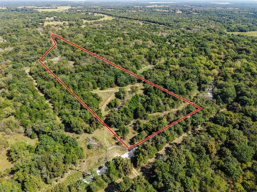 Qualifies for a 5% down financing program for buyers who meet the lender’s eligibility criteria. Discover 11 beautiful acres with nearly 700 feet of Sandy Creek frontage!  Located just west of FM 901 on Gilbreath Road, this property offers the perfect blend of privacy and natural beauty. Mature trees blanket the landscape, providing the property with privacy and the feel of  a much larger tract. Enjoy abundant wildlife right in your backyard!Electric service is currently being extended to the property, and a Two Way Special Utility District water line is available at the road. Situated outside city limits, the property benefits from an agricultural exemption already in place. Rare opportunity to own a serene country escape with great accessibility and future potential. Additional acreage is available.