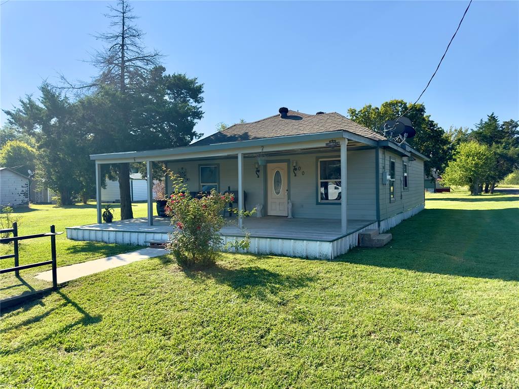 Welcome to this charming home located in the heart of Trenton! Motivated Seller!! Sitting on a spacious corner lot, this property combines small town living with plenty of room to grow. Entire home was updated in 2013. Inside you will find 3 bedrooms,  2 baths  as well as plenty of comfortable living space. Step outside to enjoy a large yard with endless possibilities. Property includes a large carport in the back with lighting and power as well as a small shed for storage and tools. Conveniently located only 8 minutes from Bonham and right off of Highway 121 this home offers convenient access while maintaining a peaceful setting.
