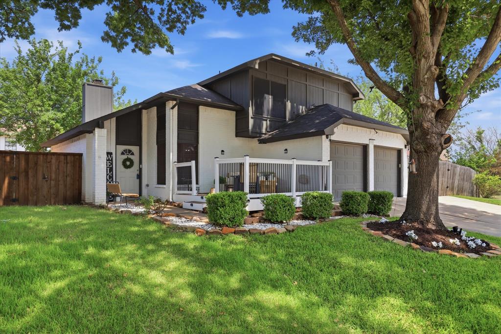 Welcome to 5321 Pocassett Dr., a beautifully updated 2-story home nestled on a spacious corner lot in the heart of South Arlington! Thoughtfully designed for both everyday living and entertaining, this 3-bedroom, 2.5-bath home features a bright and inviting living room with vaulted ceilings, an updated fireplace with modern tile and brick accents, and a flexible wet bar area perfect for a dining space, sitting room, or entertaining. The updated kitchen showcases quartz countertops, a peninsula with seating for three, and plenty of functionality. The private primary suite offers a relaxing retreat with a balcony, dual sink vanity with space for a makeup bench, separate tub, and walk-in shower. Enjoy outdoor living with a large front porch, covered patio, spacious backyard, mature trees, lush landscaping, storage shed, and gated additional parking ideal for an RV or boat. Complete with a 2-car garage, and convenient access to highways, shopping, and dining—this South Arlington gem is ready to welcome you home!
