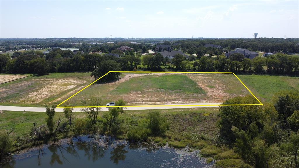 1318 Clydesdale Road in Bartonville offers a premier 2.01-acre homesite in the prestigious Eagle Ridge community, an upscale Bartonville Argyle enclave surrounded by million-dollar homes where luxury estates and scenic views define the neighborhood. This spacious parcel features level topography and a picturesque pond view, providing an ideal canvas for designing and building a custom estate. Nestled in Eagle Ridge a thoughtfully planned, luxury subdivision of just 38 two-acre-plus lots. The property features both exclusive ambiance and the freedom to bring your own builder. The community ensures privacy, space, and a refined residential atmosphere while remaining within the highly acclaimed Argyle ISD and near Liberty Christian School, combining educational excellence with unmatched lifestyle appeal. Though serene and secluded, the location is also conveniently close to Highland Village amenities, Grapevine and Lewisville Lakes, shopping, dining, golf, and major roadways, offering a rare balance of tranquility and accessibility. This is an exceptional opportunity to create a high-end residence in one of Bartonville’s most desirable communities.