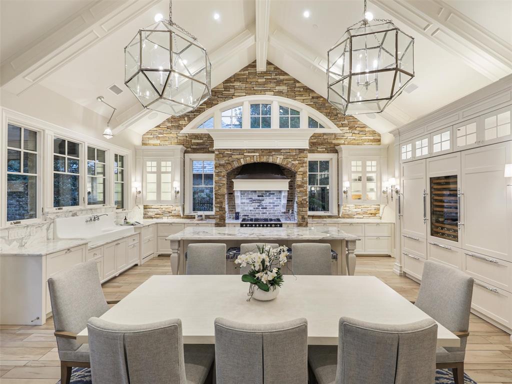 Welcome home to this Stunning Vaquero Villa built by Veranda Custom Homes. This French inspired Villa offers gracious Open plan living with custom designer features throughout. The large Great Room boasts a spacious Family room, stone fireplace, built-ins, generous Dining area + a Chef's Kitchen with marble counters, vintage sink, furniture style cabinetry, 4 beverage drawers, wine cabinet, La Cornue oven, range & Walk-up bar for entertaining. Elegant Master suite features vaulted ceilings, Chicago brick wall & charming stone fireplace. Luxurious Master bath has dual custom marble sinks, marble vanity, custom closet & access to a private outdoor shower. All bedrooms have en-suite bathrooms. Lovely Powder bath for guests + upstairs bonus room & 3 car garage. Step outside to the spectacular backyard oasis with sparkling newly remodeled pool, luxurious turf, covered patio with heaters, mosquito misters, Lynx grill & vintage sink. Enjoy stunning golf course views and perfect sunsets views!