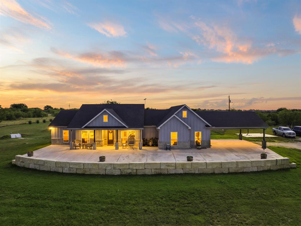 Welcome to the kind of TX Ranch property most people only dream about —peaceful country living, endless sunsets, unforgettable memories come together on over 36 breathtaking acres. This 5-bedroom, 3.5-bath ranch-style home designed for both comfort & entertaining, offering space to spread out while still feeling warm & inviting the moment you arrive through electric solar-powered gate.

The heart of the home is a stunning kitchen made for gathering, featuring quartz countertops, a massive island, walk-in pantry, all-electric appliances, & double-sided stove perfect for the chef who loves cooking. Spacious layout flows beautifully for everyday living.

Step outside & experience everything this incredible property has to offer. Relaxing evenings on the covered porch complete with an outdoor kitchen overlooking sparkling pool & expansive concrete entertaining area. Separate pool house provides convenient storage & pump equipment, making outdoor living effortless.

Need space for hobbies, work, or recreation? The impressive 40x50 spray-foam insulated shop includes an additional half bath & 20x20 bonus room inside currently used as a family media room with its own mini-split system.

The land is truly special. Two stock tanks offer fishing opportunities right on your own property, while crossed fencing & shelters in each pasture make it ideal for livestock or horses. Proeprty has an extra watermeter. Outdoor enthusiasts will appreciate private shooting range, underground tornado shelter, even unique discovery of petrified wood with geodes scattered throughout— a rare treasure for collectors & nature lovers alike. A beginning fruit orchard with underground water system adds to this one-of-a-kind property.

Exterior of the home has spray-foam insulated for energy efficiency.  Searching for a forever home, family ranch, entertaining paradise, or peaceful escape from city life, this property offers the perfect blend of luxury, adventure, & true country living.
