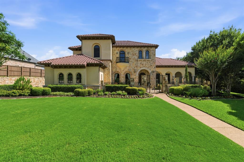 Nestled on a premier developer-selected lot in Keller's prestigious Tuscany community, bordering Westlake, this exceptional Mediterranean-inspired estate showcases timeless elegance and unparalleled craftsmanship. Every detail has been thoughtfully designed, featuring hand-scraped hardwood floors, chiseled travertine, custom inlaid mosaics, fine carpeting, Venetian plaster finishes, and stunning 12- to 18-foot wood-beamed ceilings. French doors and rich custom cabinetry add warmth and sophistication throughout.The chef's kitchen is a culinary masterpiece, equipped with professional-grade appliances, Miele built-in coffee-cappuccino machines and designed for both everyday living and entertaining. Wine enthusiasts will appreciate the impressive 540-bottle wine grotto with VinoTemp storage. The private study opens to its own patio, creating a serene workspace, while the luxurious primary retreat offers a spa-inspired bath with a jetted tub, steam shower, dual vanities, and expansive custom closets with built-ins. The thoughtfully designed floor plan includes a downstairs private guest suite, a cedar closet and grand theater room located on the main floor. Upstairs offers 3 additional bedrooms all with in-suite bathrooms, a spacious game room with a dry bar and Miele coffee machine.  Also, a hidden bonus room, perfect for a fitness space, hobby room, or additional storage.  
Outdoor living is equally impressive, featuring a fully equipped outdoor kitchen, picturesque backyard, courtyard, extensive landscape lighting, and four garage spaces with epoxy coated floors and extra overhead storage. This extraordinary residence seamlessly blends luxury, comfort, and functionality in one of the area's most sought-after locations. RECENT UPDATES INCLUDE 3 HVAC systems, 2 Hot Water Heaters, 38kva Generac Generator, attic insulation upgraded to R60 at 20 inches.