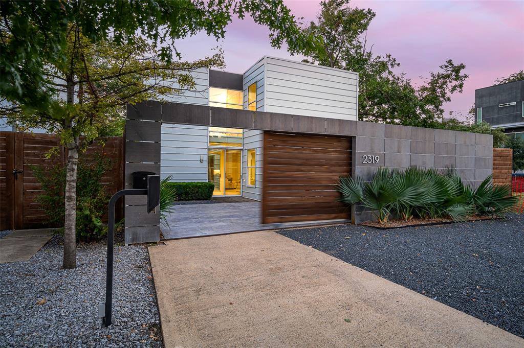 Rare opportunity to own a Modern single-family home in East Village. Stunning architecture by AIA Award-winning architect Joshua Nimmo and built by Alan Kagan. An open floor plan downstairs is ready for your parties with large glass doors that provide access to three different private outdoor spaces. The kitchen shines with new quartz counter tops and new backsplash, as well as new appliances and fixtures:refrigerator, range, vented hood, single basin sink and dish washer. The entire house is flooded with natural light and the beamed living room ceiling will bring a smile to any Modernist face. Upstairs, you will find the private areas. Spacious primary suite has ensuite bath with a large walk-in closet. The second bedroom also has ensuite bath. There is room for a desk on the upstairs landing. You will love the privacy with8-foot fence and automatic driveway gate, plus turfed backyard, side patio.