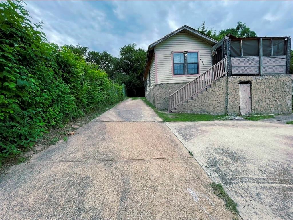 Perched atop the historic bluffs of The Bottom District, this rare property presents an exceptional opportunity in one of Dallas' most rapidly evolving redevelopment corridors. 

Positioned just minutes from Downtown Dallas, the Trinity River Corridor, major highways, and transformative mixed-use developments, the location offers tremendous potential for homeowners, investors, and builders alike.

The existing home features 1 bedroom, 1 bathroom, and approximately 980 square feet situated on a 6,900-square-foot lot. Whether you choose to restore the existing structure, renovate, reimagine the property, or redevelop the site, the possibilities are extensive.

Located within TH-3(A) Townhouse District zoning, the property offers redevelopment potential with City of Dallas development , including the opportunity for townhouse-style construction, subject to buyer verification and municipal approval.

Surrounded by ongoing infill development and newly constructed homes, Convenient access to employment centers, dining, entertainment, and transportation, this property is ideal for builders, developers, investors, and buyers. This home benefits from its elevated bluff setting, unique neighborhood character, and close proximity to Downtown Dallas. 

Buyer to independently verify zoning, development potential, building requirements, and all property information. Please do not change title company, title has ben opened, this is an estate file.

All room dimensions and total square footages are estimates calculated manually by the agent and owner. No official property card exists via DCAD. Buyer and buyer's agent to independently verify all measurements, square footage, and school districts prior to closing