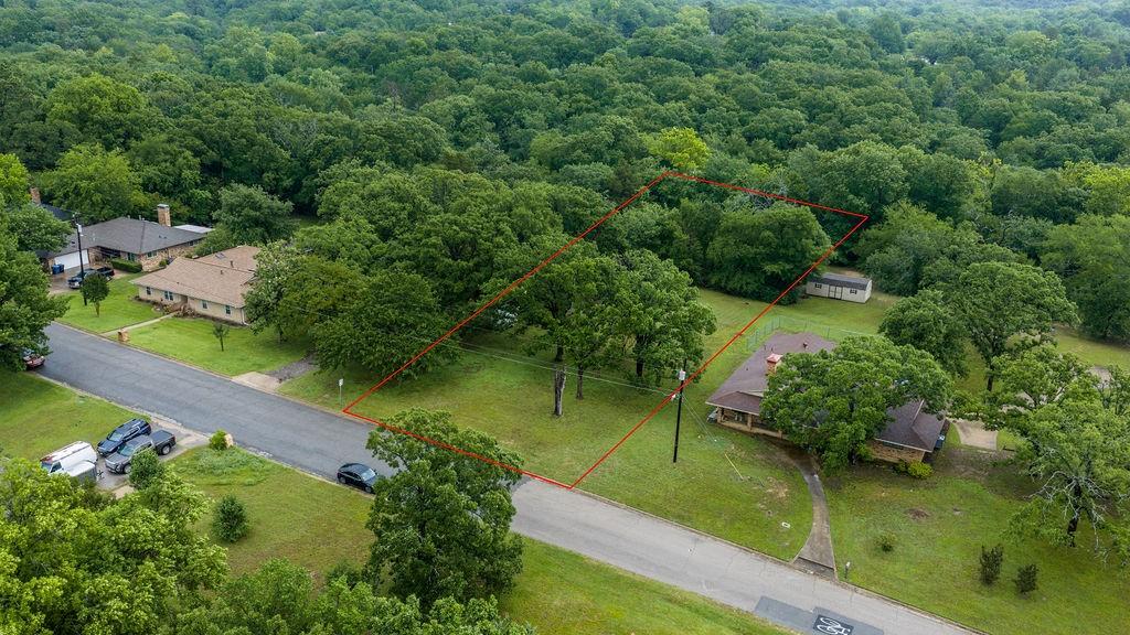 Rare opportunity to build your dream home on this beautiful .79-acre lot in Denison! Ready for development, the property still offers an abundance of mature trees that can be preserved to provide shade, privacy, and natural beauty for your future home. Ideally located just moments from Waterloo Lake, Waterloo Pool & Park, and the highly sought-after Katy Trail, this location offers endless opportunities for outdoor recreation, walking, biking, fishing, and family activities. Enjoy the convenience of nearby amenities while still having the space and setting to create your own private retreat!