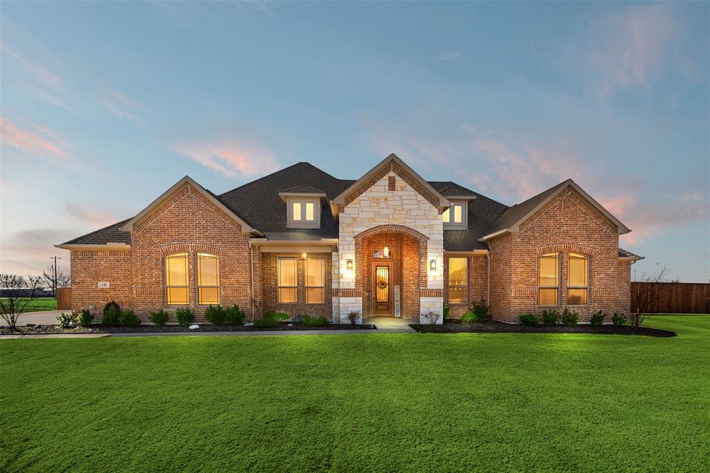 Welcome to refined country living in Springside Estates.

Situated on just over one acre, this 2023-built custom home offers the perfect blend of modern design, functional space, and peaceful Texas surroundings — all just minutes from Waxahachie conveniences.

Inside, you’ll find 2,802 square feet of thoughtfully designed single-story living with an open-concept floorplan and vaulted ceilings that create a light, expansive feel. The living room features a decorative fireplace and flows seamlessly into a beautifully appointed kitchen complete with granite countertops, large island, walk-in pantry, eat-in dining area, and designer lighting fixtures.

The private primary suite is positioned on the first level and offers a true retreat with dual vanities, garden tub, separate shower, and spacious walk-in closets. Three additional bedrooms provide flexibility for family, guests, or home office space.

Designed for both comfort and entertaining, the home includes:
• Two fireplaces (living room and outdoor)
• Covered front porch
• Smart home features
• High-speed internet capability
• Wired for sound
•3 Car garage 

The 1.02-acre lot provides room to breathe, garden, entertain, or simply enjoy the quiet beauty of country-style living with the benefit of a neighborhood setting.
Listed at $620,000, this nearly-new home offers space, style, and acreage without sacrificing modern finishes or convenience.
If you’ve been looking for newer construction on land in Waxahachie — this is it.
