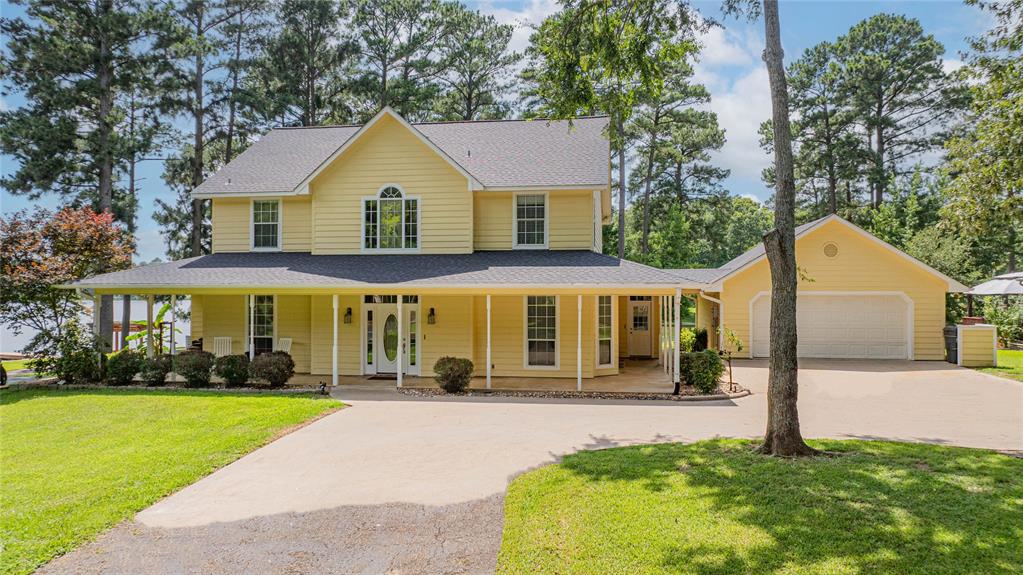 Less than 2 hours from DFW, nestled beneath a canopy of mature trees on the north side of Lake Bob Sandlin, this beautifully maintained 4-bedroom, 2.5-bath home sits on just under an acre in the exclusive, gated Mariner’s Retreat community. The peaceful, shaded setting offers both privacy and postcard-worthy lake views on the north side of the lake, where real estate can be harder to find. Inside, the home features a spacious primary suite downstairs with ensuite bathroom, an updated kitchen with a charming brick backsplash and butcher block countertops, and a flexible space ideal for a formal dining room or home office. Upstairs the additional 3 bedrooms and full bath provide room for family or guests. Step outside and take in the serene landscape—lush trees, manicured lawn, and a large back deck perfect for entertaining. Enjoy direct lake access with your own one-stall boathouse featuring an upper-level balcony for soaking in the sunsets. A recently-added bonus storage area off the garage offers space for a workshop, lawn equipment, or lake toys. Whether you’re looking for aweekend escape or a full-time lakefront lifestyle, this rare waterfront property blends charm, function, and nature in one of the most coveted spots on the lake. Let's go see your lake dream today!