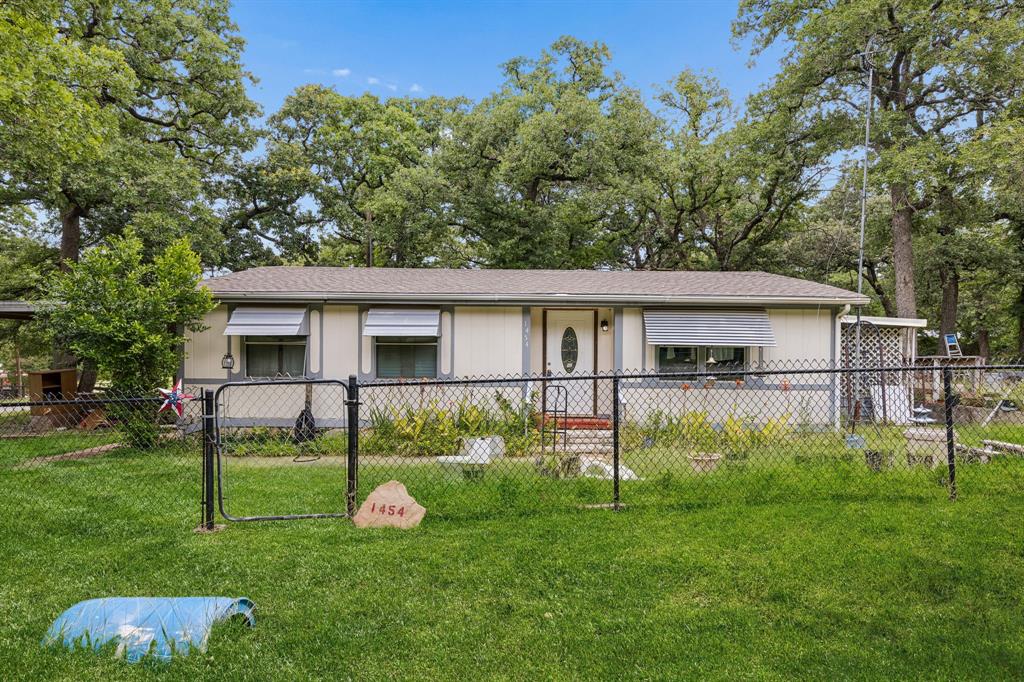 Enjoy peaceful country living with this 2-bedroom, 2-bath mobile home situated on approximately .52 acres in Azle. Offering 1,120 square feet of living space, this property provides a comfortable layout with room to make it your own. Inside, the welcoming living room creates an easy space for everyday living and gathering. The kitchen features a breakfast bar for casual dining and convenient meal prep. The primary bedroom includes a private full bath, while the generously sized second bedroom offers flexibility and could serve as a game room, second living area, hobby space, or guest room. An inside laundry closet adds everyday convenience. Step outside and enjoy the large covered patio. The property also includes a spacious storage area and a lawn shaded by mature trees, creating a pleasant outdoor setting with room to enjoy. Schedule your tour today and see the possibilities this property has to offer.