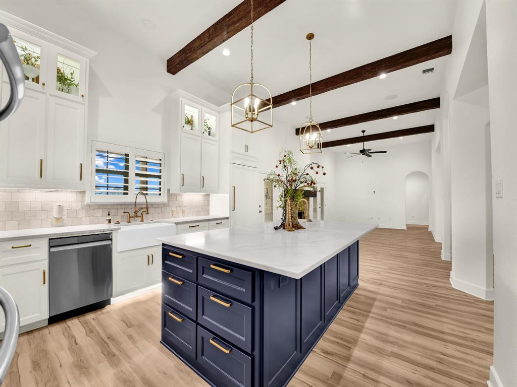 Massive multigenerational property offering a total of approximately 5,042 square feet of living space. The main residence spans 4,152 square feet per MLS, with an additional 890 sq ft private apartment above the garage that is not reflected in the MLS square footage. This separate living space includes two bedrooms, one bathroom, and a full kitchen—space you truly have to see to appreciate.

Located in Brock ISD with NO HOA, this striking Mediterranean-style home stands apart with exceptional curb appeal. From the moment you step through the arched wood front door, it’s clear this is not a cookie-cutter home—this is a home designed to be lived in, gathered in, and remembered.

The kitchen is a true showpiece. Custom cabinetry with extended glass uppers, accent and under-cabinet lighting create a warm, elevated atmosphere. The oversized island offers abundant storage and a custom-built microwave. Designed as a working kitchen, it features two sinks, a pot filler, decorative vent hood, and a built-in cabinet-front refrigerator.

Architectural details flow throughout the home with decorative beams, graceful arches with painted ceilings, and custom built-ins that define spaces while maintaining an open layout.

The main home offers 5 bedrooms, 4 bathrooms, and an oversized 3-car garage, with multiple access points to the outdoor living areas. While additional apartment offers flexibility with 2 bedrooms, 1 bathroom, and a full kitchen. The fenced backyard provides peace of mind while preserving breathtaking pond views beyond.

The finished basement includes a full bath, wet bar, and additional storage—ideal for a future game room or theater.

The primary suite is a true retreat with tranquil pond views, a private office, and direct access to a pergola—perfect for enjoying evening sunsets.

Situated directly across from Sugar Tree Golf Club, this rare property blends scenery, privacy, and lifestyle into one unforgettable home.