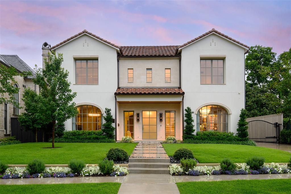 Overlooking picturesque Flippen Park, this exceptional new construction by Prous Homes blends timeless architecture w sophisticated modern living across 5,404 SF. Thoughtfully designed for elegant entertaining & everyday comfort, the home offers 5 ensuite bedrooms, 5 full baths, & 2 half baths enhanced by designer finishes, custom window treatments, rich hardwoods, marble accents, & meticulous craftsmanship throughout.
A gracious floor plan features formal living & dining rooms, expansive family room w herringbone gas fireplace, gourmet eat-in kitchen, butler’s pantry, wet bar, mud room, oversized utility room & climate-controlled screened patio w retractable screens for seamless indoor-outdoor living. The formal living room or study is anchored by a striking black marble fireplace, while the chef’s kitchen is outfitted w La Cornue, Sub-Zero, Wolf & Asko appliances, oversized Rohl farm sink & custom marble and tile finishes. The dining room features a coffered ceiling & designer wallpaper alongside a beautifully appointed wet bar w Sub-Zero wine refrigeration & Scotsman ice maker.
Privately situated upstairs, the luxurious primary suite offers a spacious sitting area, spa-inspired bath w standalone soaking tub & oversized shower, & dual boutique-style walk-in closets w specialty lighting. Additional ensuite bedrooms, generous living spaces, third-floor guest retreat, & detached guest quarters above the garage provide exceptional flexibility for visitors, office space, or multigenerational living.
Completed in 2024, the home features a stucco exterior, clay tile roof, foam insulation, whole-house water filtration & softening system, Generac generator, four HVAC systems, three Navien tankless water heaters, electric driveway gate, turfed backyard, landscaped grounds w irrigation, covered patio & epoxy-finished 2-car garage.  Perfectly positioned overlooking one of Dallas’ most beloved parks, this residence offers a rare blend of luxury, comfort & timeless design.