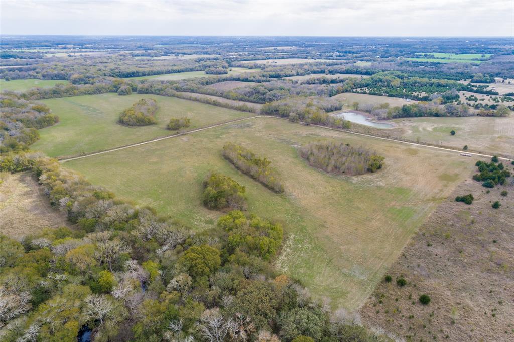 Over 26 acres in the path of progress. Approximately thirty-minutes from not only the newly opened Boise D'Arc Lake, but also the soon-to-open Lake Ralph Hall. This is your opportunity to buy now and reap the benefits of future developments. Invest now - develop later and maximize your profit. 
 Or build your dream home, bring your livestock, and relax in your private and secluded retreat. 2 parcels being sold together and will not be subdivided. Both rectangular-shaped flat land parcels have some trees and lots of road frontage. Located at the 90-degree bend you have road frontage on two-sides.  Survey is available.  No utilities currently at the property, but they are available nearby. Property is located approximately 20-minutes from Melissa TX, and approximately 30-minutes to Greenville or Sherman.