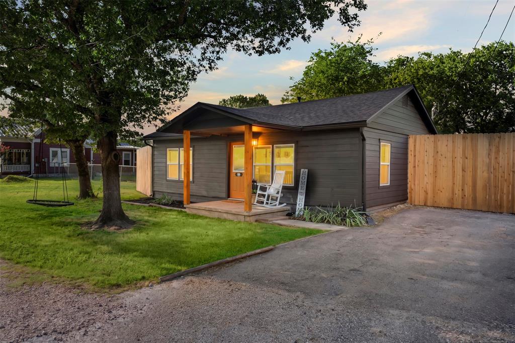 OPEN HOUSE July 2nd & July 3rd 10am -12PM & July 5th 2pm-4pm! This charming move-in ready home features 2 bedrooms and 1 bathroom. Inside you will find a bright, inviting layout with stylish finishes throughout. Enjoy piece of mind with updated flooring throughout, a new roof completed in 2025 and a new HVAC unit installed in 2020. From the moment you step inside, the warm and cozy atmosphere makes you feel right at home. Step outside and relax on the covered front porch or take advantage of the spacious backyard featuring a 24x24 shop equipped with electricity and a roll up door, making it perfect for a workshop, hobby space, extra storage, or parking. The concrete driveway provides ample parking and adds to the property's convenience.  Conveniently located just minutes from historic downtown Waxahachie, shopping, dining, schools, parks and major highways. This property blends comfort, convenience, and charm—an ideal place to call home.