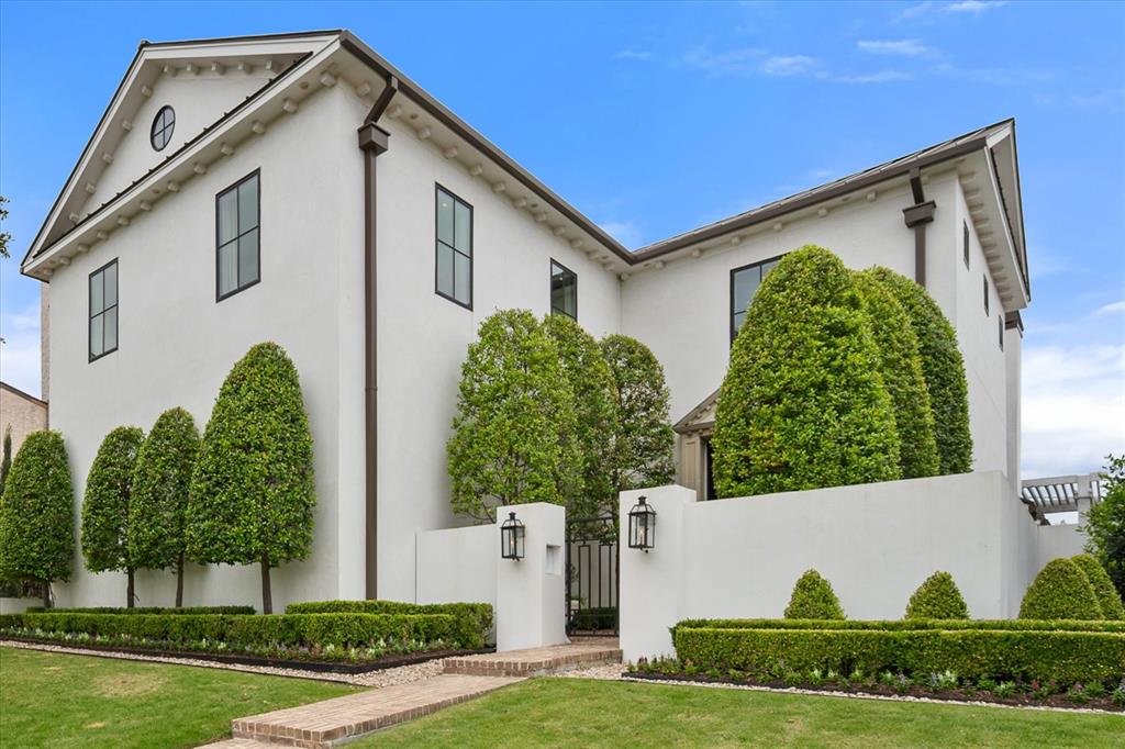 Set within Riverhills Phase 2, this thoughtfully designed residence pairs elevated finishes with a layout that lives beautifully for both everyday use and entertaining. With the primary suite positioned on the main level and all secondary bedrooms plus a spacious playroom upstairs, the floor plan offers a smart separation of space while maintaining an easy, connected flow. Just off the primary, a private TV room creates a quiet retreat—ideal for unwinding without leaving the main level. The heart of the home is anchored by a well-appointed main kitchen featuring a Wolf range, complemented by a fully equipped prep kitchen that keeps everything running seamlessly behind the scenes. A stylish wet bar with generous wine storage adds another layer of functionality for hosting. The main living area is filled with natural light and connects effortlessly to the outdoors, with two sets of double Marvin doors opening to the backyard, along with an additional set of doors in the dining room that further enhances the indoor-outdoor flow. Throughout, high-end designer finishes—including Schumacher wallpaper—bring depth and character, while 11-foot ceilings (and 13 feet in the dining room) enhance the sense of scale and light. Quality construction is evident at every turn, with carefully considered details that elevate the overall experience. Outdoor living is just as compelling, with a turfed backyard and putting green designed for both recreation and low-maintenance enjoyment. The rooftop patio offers an additional entertaining space, capturing wide-reaching views over Fort Worth and creating a setting that feels both relaxed and refined. Complete with a three-car garage and ideally located just a quick drive to Fort Worth Country Day School and Waterside’s dining and shopping, this home delivers a well-balanced combination of design, functionality, and location in one of Fort Worth’s most sought-after areas.
