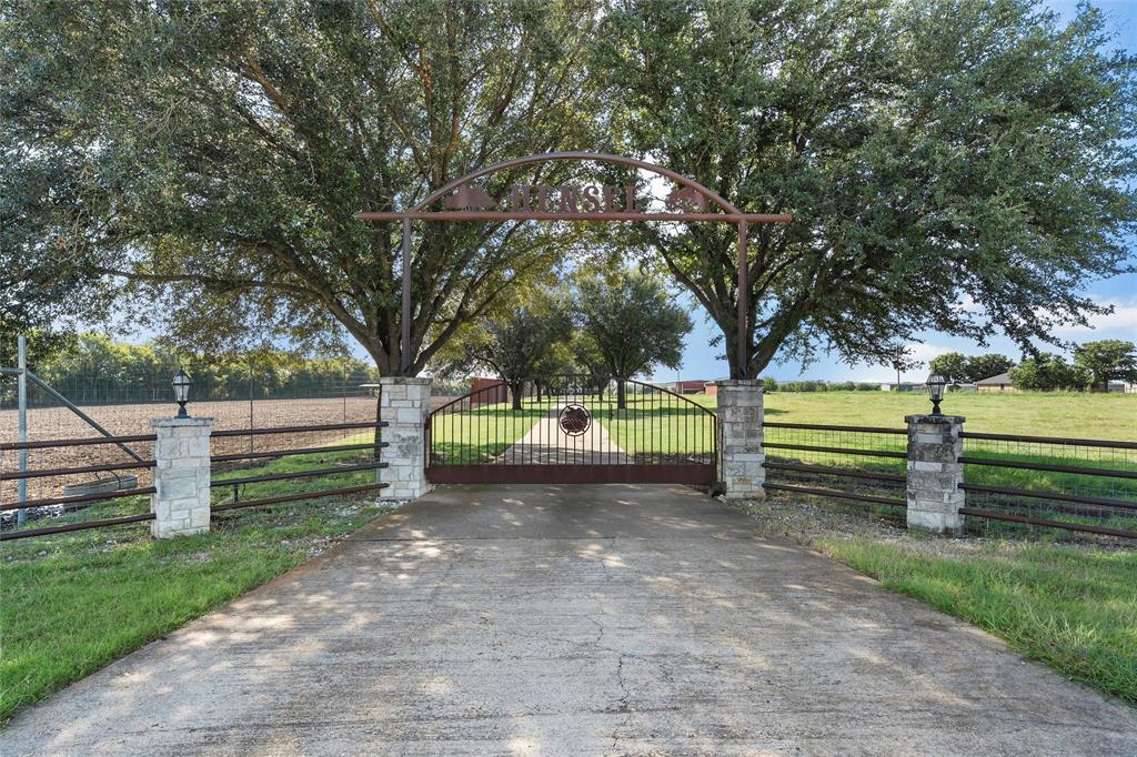 Modern Country Living on 15 Acres in South Bosque Elementary School.

Welcome to your dream property! This beautifully updated 4-bedroom, 4 bathroom, two-story home offers the perfect blend of modern comfort and wide-open space. Situated on 15 fully fenced acres (majority is high fenced) with a gated electric entry and paved driveway, this property delivers privacy, convenience, and room to roam.

Step inside to discover two spacious living areas, granite countertops, stainless steel appliances, and stylish finishes throughout. The open-concept layout is ideal for both family living and entertaining. The roof was replaced in 2024, the outside was painted in 2025 and the interior was painted in 2024. All the bathrooms were remodeled within in the last 5 years. Talk about move-in ready!

Outside, enjoy the freedom of country living with a tank, high fencing, and not one—but two massive 2400 sq ft shops ready for work, storage, or hobbies. Both shops have water and electricity. You will also notice two covered feed stalls and five 3 sided barns. Need a place to unwind? The dedicated mancave is your personal retreat, perfect for game days or relaxing evenings.

Whether you're looking for a family homestead, hobby farm, or the ultimate live and work setup, this property checks all the boxes.