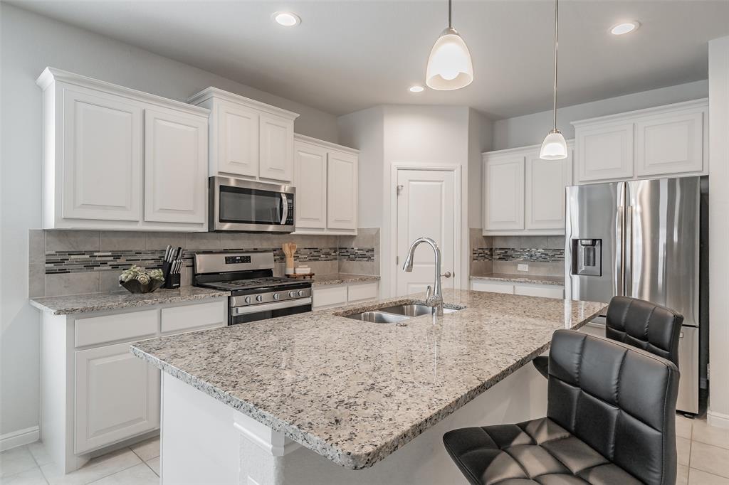Motivated Seller...No MUD tax. No PID tax. Paid-off solar panels. Single-story home on the only quiet cul-de-sac street in Trails of Elizabeth Creek. Built in 2022 and move-in ready, this home offers an open layout designed for comfortable everyday living and easy entertaining. The main living, dining, and kitchen areas flow together seamlessly, creating a bright central gathering space. The kitchen features a large island with seating, granite countertops, stainless appliances, gas cooktop, tile backsplash, and an oversized pantry. The private primary suite is tucked at the back of the home with dual sinks, soaking tub, separate oversized shower, and a large walk-in closet. Secondary bedrooms and a front study provide flexible space for guests, work from home, or hobbies. Energy-efficient features include a tankless water heater, smart home technology, full sprinkler system, covered patio, fenced backyard, and fully paid solar panels for immediate utility savings. Located in Northwest ISD with Hatfield Elementary inside the neighborhood. Community amenities include a pool, lazy river, cabana, parks, and convenient access to I-35W, shopping, dining, and entertainment. Newer construction, lower taxes, energy savings, and a peaceful cul-de-sac setting make this home a standout.