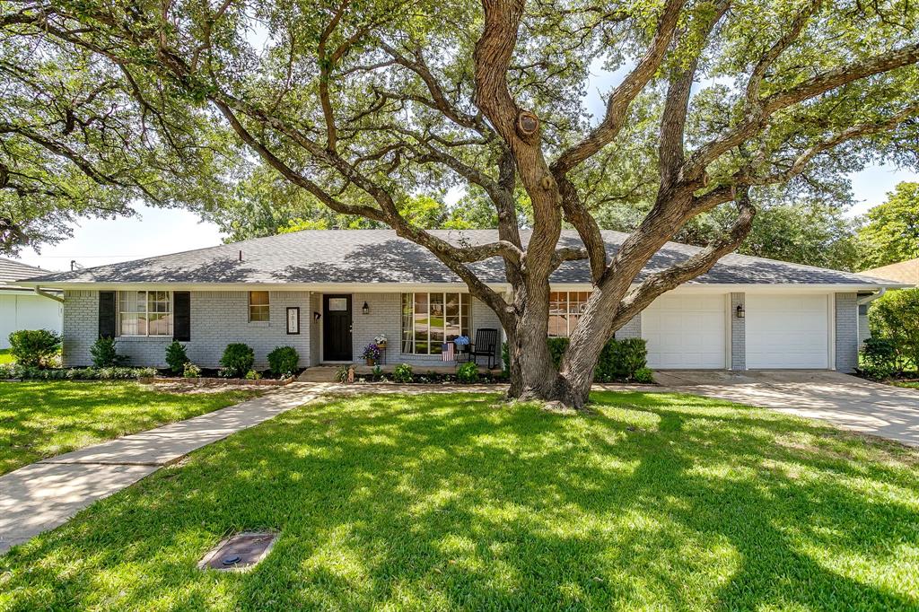 Welcome to this beautifully reimagined 4-bedroom, 2.5-bath home on a spacious lot in highly sought-after Wedgwood East. Framed by towering mature oak trees and showcasing incredible curb appeal, this home blends timeless character with extensive modern updates. Designed for both everyday living and entertaining, the flexible floor plan features two spacious living areas, two dining spaces, and a sunroom filled with natural light thanks to brand-new windows overlooking the lush backyard. Whether enjoying your morning coffee or hosting family and friends, this bright, inviting space is sure to become a favorite. The split fourth bedroom, located just off the laundry room, offers custom built-ins and exceptional privacy, making it an ideal home office, guest room, playroom, or hobby space. The fully renovated kitchen is the heart of the home, featuring new cabinetry, updated hardware, a stylish backsplash, high-end granite countertops, and updated lighting. Additional interior improvements include fresh paint, new flooring throughout most of the home, updated bathroom lighting and mirrors, a new dining room chandelier, new breakfast nook lighting, and a beautifully updated German schmear wood-burning fireplace. Major improvements provide peace of mind, including repaired foundation with a transferable lifetime warranty, completely upgraded plumbing with a 10-year warranty on materials and labor, and a brand-new roof to be installed before closing with the buyer choosing the shingle color. Additional updates include a new privacy fence, refreshed landscaping, new laundry room tile, and new sunroom windows. Offering generous living space, quality updates, and major system improvements in one of Fort Worth's most established neighborhoods, this move-in-ready home is the perfect blend of charm, function, and value. Conveniently located near shopping, dining, parks, and major commuting routes. Don't miss your opportunity to make this exceptional Wedgwood East home yours!