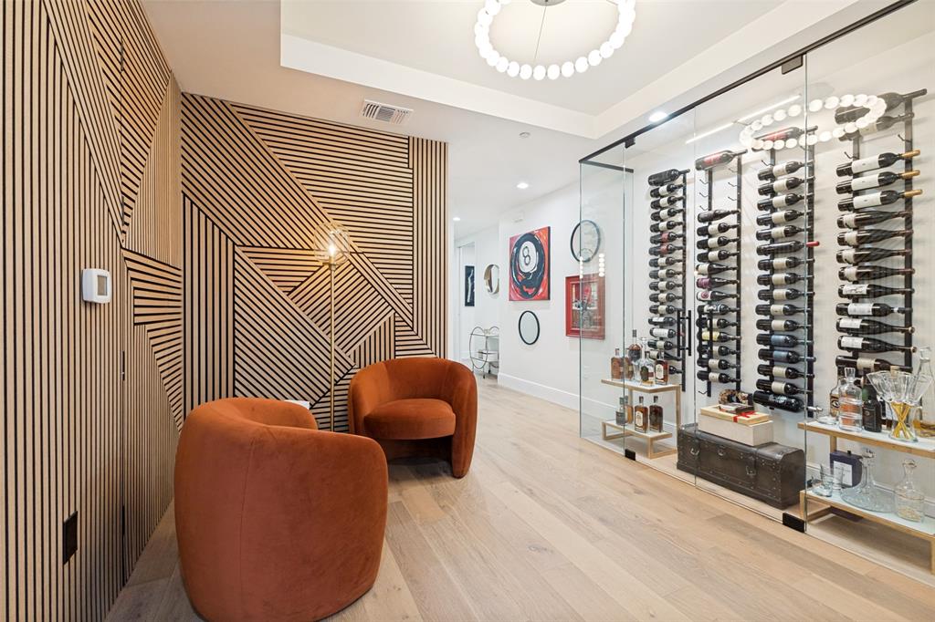 STUNNING! SOPHISTICATED! Feel luxury and attention to every detail when you walk into this unique custom designed Condo in the Heart of Downtown Dallas. This 1505 Elm 14th Floor home welcomes you to a light filled experience from 10 large windows with expansive views of many well known examples of 20th century architecture plus magnificent breathtaking sunsets past Victory and the Trinity River! This George Dahl designed Mid-Century Modern building, built in 1957 for Dallas Federal Savings, was converted to condos in 2002-the first condo project in the CBD. This home was updated with upgraded new materials and components in 2023 by Andregg Design & Construction. From the minute you walk through the door, take note of the stunning contemporary feel that transports you to what would be a $1,000,000+ home in other downtown hi-rises. The European white oak 7' wood plank flooring throughout the entry, living &bedrooms, freshly painted walls, ceiling & millwork with architectural wood accent walls set the stage for the feeling of tranquility and peacefulness. The kitchen is a Chef's dream with 10' modern European kitchen cabinets with quartz countertops and GE Monogram Appliances. Ask for the 1403 Upgrade List! Since 2021 the $460,000,000+ National Residences & Thompson Hotel have been located across Akard in the former First National Bank building. 1505 Amenities: 24-hr Concierge, Drive-in Porte Cochere, 24-hr Valet for Residents and up to 5 Guests-no tipping; floor B-1 features a caterer's kitchen, wine cellar, party area with piano, darts, pool, TV; floor B-2 includes a 15-seat Theater Room, state of the art Fitness Center and Bike storage; 5th Floor Resident-Outdoor retreat-Pool, 3 cooking pavilions, dog run, sitting areas, AT&T wi-fi. Walk to Flagship Neiman Marcus, shops, restaurants, hotels, Arts District, AT&T Discovery District and Parks. Dart Akard Station across street to DFW in 50 minutes, Love Field in 30 minutes, NorthPark faster than you can drive and park!