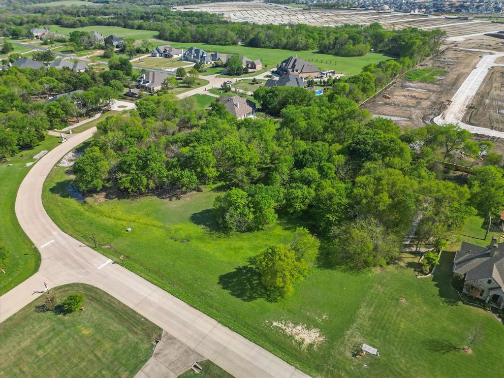 Discover one of the finest opportunities in the prestigious Waterstone Estates! This expansive 1.6-acre corner lot is a rare gem, offering a perfect blend of privacy and natural beauty with an abundance of mature trees. The elevated terrain provides the ideal canvas to design and build your dream home, tailored to your unique vision.
Located within the exclusive gated community of Waterstone Estates, you'll enjoy serene surroundings while being just minutes away from the conveniences of McKinney. Whether you're envisioning a luxurious estate or a tranquil retreat, this lot offers endless possibilities. Best of all, you have the freedom to choose your own builder to bring your vision to life.
Don’t miss this extraordinary opportunity to own a prime piece of land in one of McKinney’s most sought-after neighborhoods.