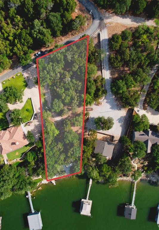 Positioned on the highly sought-after peninsula of Possum Kingdom Lake, this exceptional waterfront lot offers the perfect opportunity to build your dream lake home in one of the area’s most desirable locations. With convenient access directly off FM 2951, the property is easily reachable even with large boat trailers making this a very unique attribute for Trail Ridge Rd.

The lot offers a rare combination of usability and character featuring a wide, mostly level entry ideal for parking, storage, or a future shop, then gently transitioning to elevated terrain with natural rock features that can be beautifully incorporated into your build and landscaping. Deep water frontage provides excellent boating access, while the elevated setting captures stunning, unobstructed views of Possum Kingdom Lake.

An existing cabin is located on the property and will need to be removed, giving you a clean slate to design and build exactly what you want.

Whether you’re envisioning a weekend escape or a full time lakefront retreat, this property delivers the location, accessibility, and waterfront quality that are increasingly hard to find on Possum Kingdom.