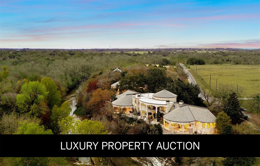 AUCTION BIDDING OPEN: Bidding ends February 28th. Previously Listed 5.95M. Current High Bid 2.75M. 
An extraordinary legacy opportunity awaits at Oxbow Overlook, a magnificent architectural masterpiece perched high above Salado Creek on thirteen pristine acres of meticulously manicured Texas landscape. This incomparable estate captures the essence of refined Hill Country living with its dramatic wrought iron entry gate, stunning courtyard, and mature live oaks creating a majestic approach. A striking 24-foot entry wall of iron and glass reveals a grand foyer crowned by a 31-foot copper dome ceiling hovering above a sweeping quarter-sawn oak staircase with copper accents. Seven fireplaces, including an outdoor feature, complement the native limestone construction throughout. Creek-side walls, terraces, and outdoor living spaces conform to the bluff's natural curve, offering spectacular vistas across the property and showcasing exceptional craftsmanship with thoughtful conveniences at every turn..
