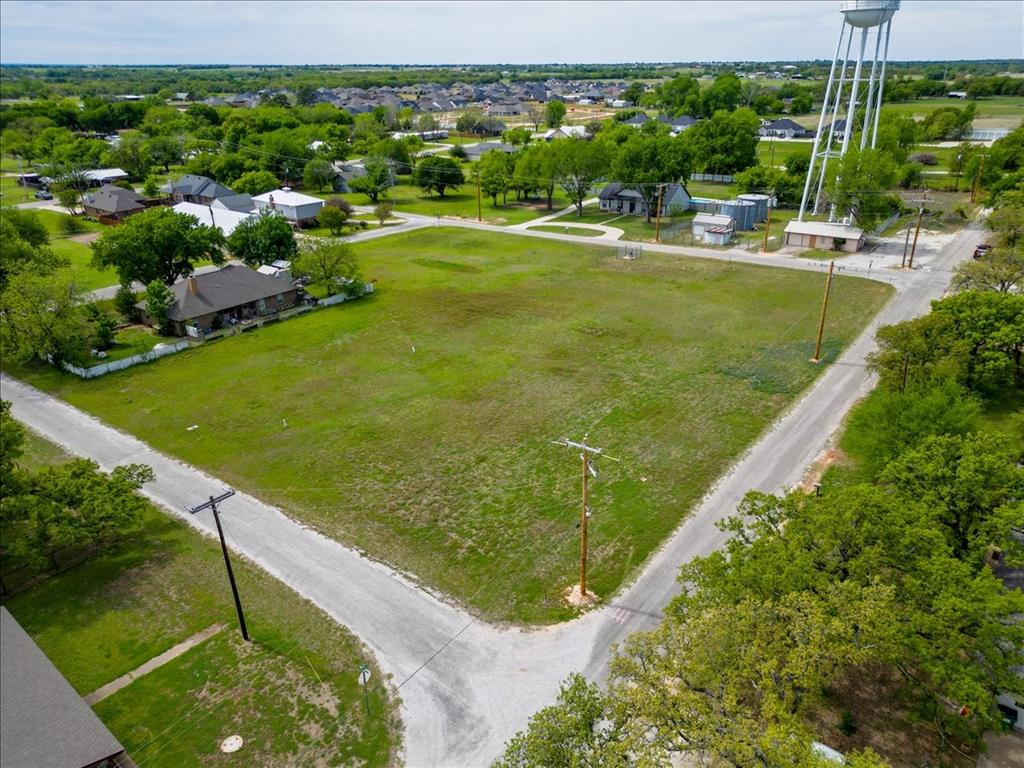 Build your dream home on this prime vacant lot in the heart of highly sought-after Tolar ISD! This clean slate offers endless possibilities with city water, sewer, and trash services available - making your building process even more convenient. Enjoy the charm of small-town living while being just minutes from Granbury, where you’ll find shopping, dining, entertainment, and access to beautiful Lake Granbury. The hospital and medical facilities are nearby, and you’re just over an hour from Fort Worth for an easy commute. Don’t miss this opportunity to create something truly special in a growing and desirable area!