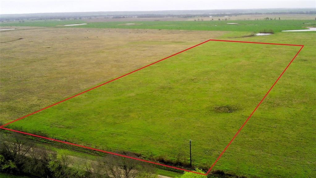 Looking for 11+ acres of rural residential land within 30 minutes of Waco, then come look at Lot 13 of High Meadows Ranch development. The rectangular-shaped property is clear and level with native grass, offering multiple building sites for a homestead. Light deed restrictions include no manufactured homes or permanent travel trailers, nor commercial activities. Navasota Valley Electric Coop electricity is available, and Tri-County SUD is the water provider. There is an additional 11 acres adjacent to this property (Lot 14) that is also available.