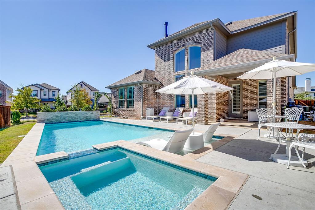 Welcome to this beautifully designed 4-bedroom, 3-bathroom home on a premium corner lot of nearly a quarter acre in the coveted master-planned community of Walsh Ranch in Aledo ISD.  The main level features a bright, open-concept layout with soaring ceilings, a spacious living room with fireplace, and a chef-inspired kitchen with custom cabinetry, built-ins, and an inviting dining area—perfect for entertaining. The oversized primary suite offers a serene retreat with a custom California Closet, while the secondary main-level bedroom functions as a private guest suite with its own ensuite bath and custom California Closet. A dedicated office and utility room complete the first floor.  Upstairs, you’ll find a large game room, media room, and two additional bedrooms with a shared bathroom—ideal for family or guests.  Stunning plantation shutters are installed throughout the home. Rarely available in Walsh, this home features a recently completed pool and spa, both of which can be heated for year-round enjoyment, surrounded by generous patio space for outdoor dining and relaxation, along with the luxury of ample play space on its spacious corner lot.  Additional highlights include a 2-car garage with EV charger and beautifully landscaped grounds.  Enjoy resort-style living in Walsh Ranch, offering exceptional amenities such as parks, pools, fitness center, maker space, tennis courts, and miles of trails—all within the award-winning Aledo ISD.  This home seamlessly combines luxury, comfort, and community—a true Walsh Ranch gem!