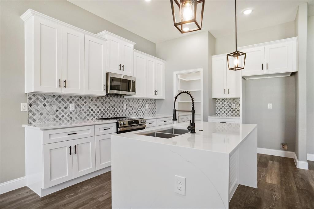 GATED & GUARDED COMMUNITY*NEW CONSTRUCTION BY BLUE RIBBON HOMES*2 POOLS*2 TENNIS COURTS*CLUBHOUSE*2 BOAT RAMPS*ACCESS TO LAKE GRANBURY*SWIMMING, BOATING & FISHING*1-STORYBEAUTY*LARGE BACKYARD W-COVERED PATIO*LOT IS 60 X 119, APPROX  .158 acre lot*WOODED LOT*FENCED*CITY WATER & SEPTIC *QUALITY CONSTRUCTION*QUARTZ COUNTERS*KITCHEN W-WATERFALL ISLAND, GE APPLIANCES, RECYCLE DRAWER, COFFEE BAR, WALK-IN PANTRY W-STORAGE & SHELVING*4-BURNER ELECTRIC RANGE*42-INCH WHITE CABINETRY W-BLACK PULLS*STAINLESS SINK*LAUNDRY ROOM W-QUARTZ COUNTERS,SINK, ROOM FOR FREEZER*PROPELLER FANS & LUXURY WATERPROOF VINYL FLOORING-EDWARDOAK*LIVING W-REMOTE ELECTRIC FIREPLACE, STONE SURROUND & HEARTH*FIREPLACE CAN EMIT HEAT OR PROVIDE AMBIANCE*OPEN FLOOR PLAN*3 BED, 2.5 BATHS*LOVELY PRIMARY SUITE W-ELEGANT BATH,STAND-ALONE TUB, HUGE SHOWER W-FRAMELESS GLASS*OVERSIZED CLOSET*HOA $308 YR*2 CAR GARAGE W-SINGLE DOOR*ATTIC PULL-DOWN*CEILING FANS THROUGHOUT*SPECIAL FINANCING AVAILABLE* 5 PERCENT DOWN PAYMENT ASSISTANCE*YOU DO NOT HAVE TO BE A FIRST TIME HOMEBUYER* 6 AND ONE EIGHTH RATE PROGRAM AVAILALBE TOO*CALL FOR DETAILS*SEE 360 TOUR*
