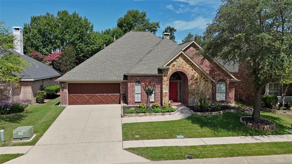 Meticulously maintained single-story in the coveted Eagle Creek of Stonebridge Ranch! No neighbors across! A beautiful brick and stone facade, mature trees, and immaculate landscaping highlight the drive-up appeal of this home! Inside you will find 4 bedrooms, 2.5 baths, formal dining area, dedicated study, and oversized 2-car garage with sink! Upgrades and amenities include rich hardwood flooring throughout main living areas, neutral paint tones throughout, upgraded lighting fixtures, split bedroom for added privacy, abundant natural lighting throughout, generous storage space including a floored attic, spacious family room with built-ins and cozy fireplace, foundation drip line around entire home, and MORE! Kitchen is conveniently nestled between a formal dining area and breakfast nook, ideal for hosting and large gatherings, and boasts granite countertops with a tumbled stone backsplash, stainless appliances including a gas cooktop, breakfast bar, and large walk-in pantry. Primary retreat with bay window sitting area offers a luxurious ensuite bath with dual vanities, garden tub with separate shower, and large walk-in closet. Private, shaded backyard is complete with an expansive pergola-covered patio area!