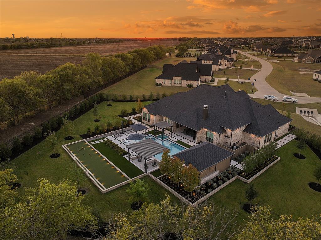 Elevated living in Parker, TX — an extraordinary estate in the coveted Kings Crossing enclave, where nearly 5,000 sq ft of masterfully crafted living space invites you to live larger than you ever imagined. Designed for the way real families actually live, every inch of this home has been thoughtfully curated to deliver space, serenity, and an effortless sense of belonging for those who refuse to compromise.
Over $1.3M in post-purchase upgrades transform this from a beautiful house into an unrivaled living experience. These are not surface-level updates — they are deep, meaningful enhancements to comfort, security, and livability that would cost far more to replicate today and simply cannot be found in any new construction at this price point.  Experience this home for yourself. 
Step inside to rich wood flooring and hand-crafted cabinetry with whisper-soft close doors and drawers throughout. Every interior wall is insulated for sound, creating a hotel-like calm even when the home is full. The open layout flows effortlessly for entertaining yet offers natural pockets of privacy. A generous executive office — easily convertible back to a fourth bedroom at seller's expense — makes remote work feel like a privilege. Spa-inspired bathrooms with heated toilet seats and elevated finishes turn everyday routines into restorative rituals. A whole-home generator means you'll never lose a beat, and a storm-rated safe room plus reinforced primary suite doors deliver peace of mind that money simply cannot replace.
Outside, a resort-style pool and lushly designed outdoor living areas beckon you to entertain, unwind, and make memories. Over 100 carefully chosen trees form a maturing green sanctuary that grows more beautiful — and more private — every single year. Resort style living in your very own backyard. Kings Crossing offers grand estate lots, peaceful streets, and a true neighborhood spirit. This is not just square footage; this is a life well-designed.