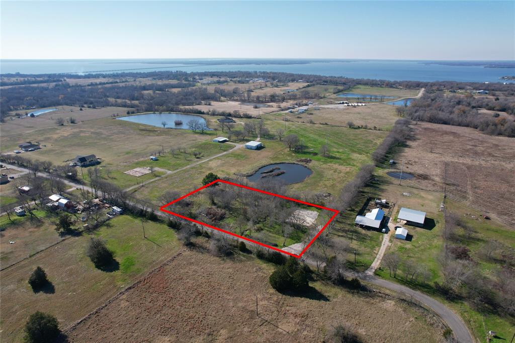 Great 2 acre parcel in the loving community of Lone Oak, TX. Just minutes away from a true Texas Fishing Lake, Lake Tawakoni and just about an hour east of Downtown Dallas. Located approx 20 mins from Quinlan and 25 mins from Greenville for all shopping and dining amenities. Quick needs can be met with a few discount stores and dining options just a short drive into Lone Oak.  Over 15 loads of select fill already on site for your housing or barndo project. Electric and Water close at road, no meters have been installed. Over 360 ft of road frontage- great lot for a circle drive! Quite a few custom farmhouse style NEW builds up and down this county road make for a lovely scenic drive with great surroundings. NO HOA, NO RESTRICTIONS! Come envision your dream today! Ask listing agent for drone fly over video.