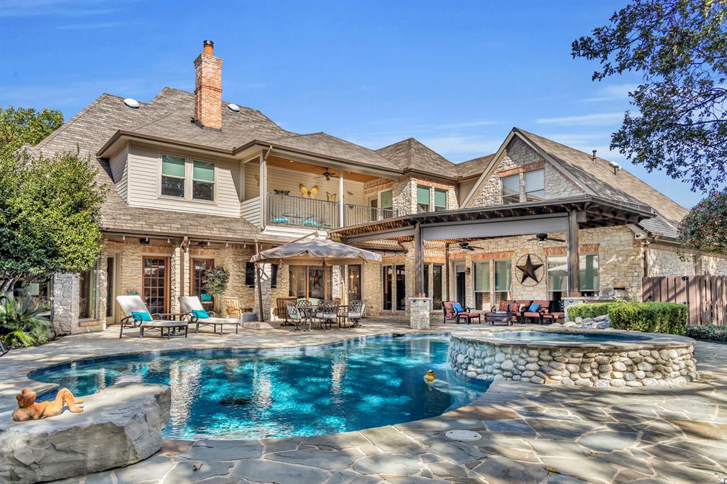 Located in one of the most desirable and prestigious neighborhoods in Colleyville, Leyton Grove, this warm and sophisticated home is sure to offer space for the whole family.  Upon entering the elevated foyer, the elegant lattice entry flooring and curved staircase makes for a grand welcome.  Builtins and storage in the formal living room and office start to show off the expansive custom wood work that carries throughout the entire home.  Open concept family room, updated island kitchen, and breakfast room overlook the gorgeous backyard with large single pane updated windows.  Downstairs also features the primary suite on the West wing of the home, while the mother-in-law or guest suite is located on the East wing.  Get ready to be awed by the beautiful backyard with lots of covered patio space, mature trees, and large pool plus spa with PebbleTec surface.  Take either of the two staircases upstairs to play in the large game room with handscraped hardwood floors, enjoy movie night in the huge media room, and feel the breeze from the balcony overlooking the serene backyard.  The 3 large upstairs bedrooms are equipped with ensuite bathrooms and walk-in closets, while the bonus room (currently used as a craft room) could be the 6th bedroom which is entered from the gameoom.  Plenty of parking for guests and space for the hobbyist with a circle drive, 4-car extra long garage (split as two 2-car garages with motorcourt), plus an extra long parking space next to the rear garage towards the backyard.  A perk of this tucked away neighborhood is the private gate access to walk to the highly ranked O.C. Taylor Elementary School.  This home has been meticulously maintained!  Pool re-plastered and re-tiled in 2022.  Many Smart Home features including pool controls, sprinkler system, thermostats, RING doorbell, garage door openers, electric shades on windows, backyard Sonos speaker system, etc.  See list of Features and Updates in Documents.
