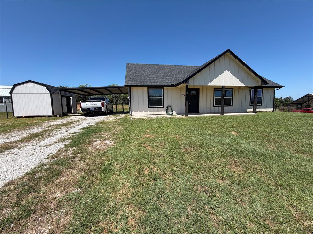 This beautiful 3-bedroom, 2-bathroom house is nestled in the serene countryside, offering the perfect blend of comfort and tranquility. Brand new carpet installed January 2026. It boasts a spacious and inviting layout with a large kitchen, complete with an island that's perfect for meal prep. Master suite has a large walk-in closet and an attached bathroom. Each of the additional bedrooms are bright and airy, with ceiling fans to keep you cool during those warm summer days. The expansive lot provides plenty of outdoor space for activities, and the large fenced yard is perfect for pets or family gatherings. Covered carport and large shed for extra storage.