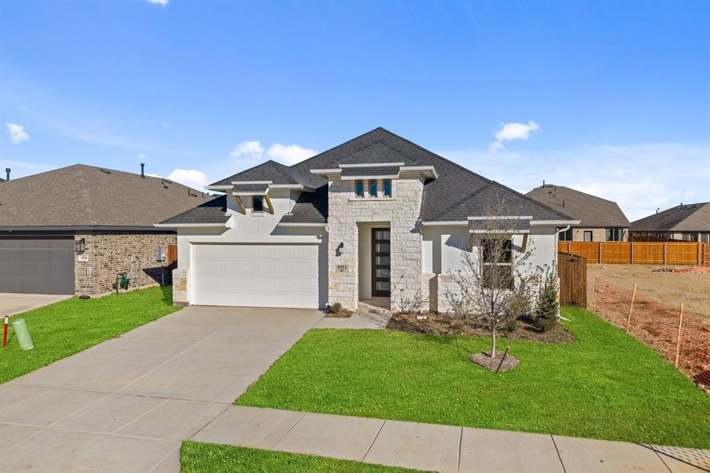 MLS# 20985442 - Built by Coventry Homes - Dec 19 2025 completion! ~ Step into sophisticated living with this beautifully designed 4-bedroom, 3-bath home that blends modern style with everyday comfort. The unique exterior elevation makes a bold statement and sets the tone for what lies within. Enter through the sleek, contemporary front door and discover a space curated with upscale finishes and tasteful design throughout. The dream kitchen is anchored by a massive natural stone island, perfect for entertaining or casual family mornings. Custom cabinetry includes a built-in trash pull-out, keeping your space effortlessly clean and clutter-free. The open-concept great room features a cozy fireplace for warm gatherings and relaxed evenings. Retreat to the luxurious primary suite, where relaxation is a given. The ensuite boasts raised double vanities for convenience, a soothing garden tub, and a striking sunken shower with elegant hexagon tile flooring. Every detail in this home speaks to intentional design - schedule your tour today!