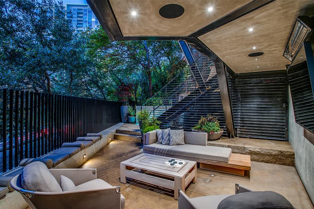 3-level townhome provides the height of sophistication after a 2017 renovation that, among other improvements, gives the two-bed, two-bath unit a third outdoor living area unique to much-desired Magnolia Hill Court, a gated community. Lower level, a FP & water feature; off the guest suite, a sitting area; & on the top level outside the kitchen, outdoor dining & a gas grill. The lower & mid-level patios boast heated ceilings. The rest of the renovation: a Downsview kitchen, black-honed granite countertops, Sub-Zero refrigerator, Dacor warming drawers, Thermador stove top & oven, & a Bosch dishwasher. Dry bar with two Sub-Zero beverage drawers & a Sub-Zero wine cabinet. California Closets in the primary suite. Control4, a home automation system, allows you to adjust lighting, audio & visual, door locks, exterior heaters & security cameras from a phone app. Access to a community pool, downtown, the AAC, Dallas North Tollway & the Katy Trail next door makes this a dream destination.