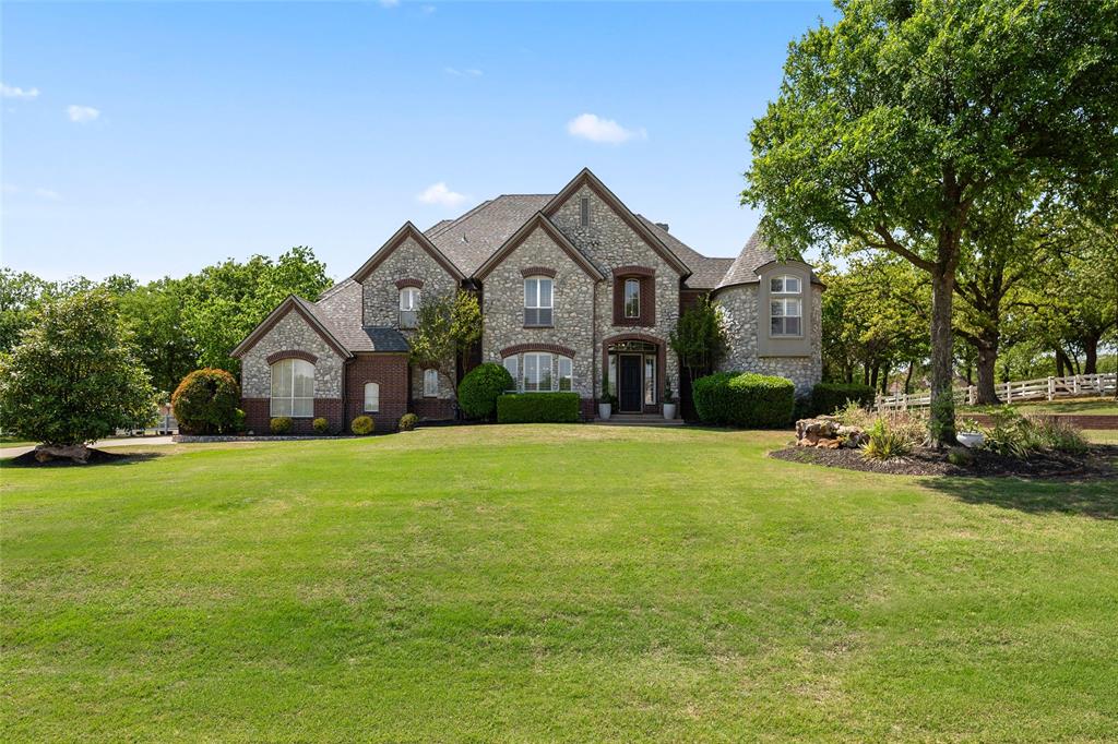 Motivated sellers! Beautiful home in ARGYLE ISD & NEAR LIBERTY CHRISTIAN! This home is absolutely amazing and has all of the Argyle must-haves! The backyard oasis features a huge party pool with diving rock & waterfall, a covered outdoor living space with a wood burning fireplace, has a fire pit for cooler nights, and still has space for your horses! A small barn and cross fencing provide the perfect space.  The large covered outdoor patio is perfect for entertaining and is plumbed for gas. Inside, a second downstairs bedroom with an en suite bath and a private entrance suits guests or multi-generational living. Upstairs, the media room has a separate space for a game room or dining room and includes a wet bar. An added bonus: this home has a lightning protection system! 
This 2.5 acre property with mature trees is a rare find in Argyle! Schedule a tour today!