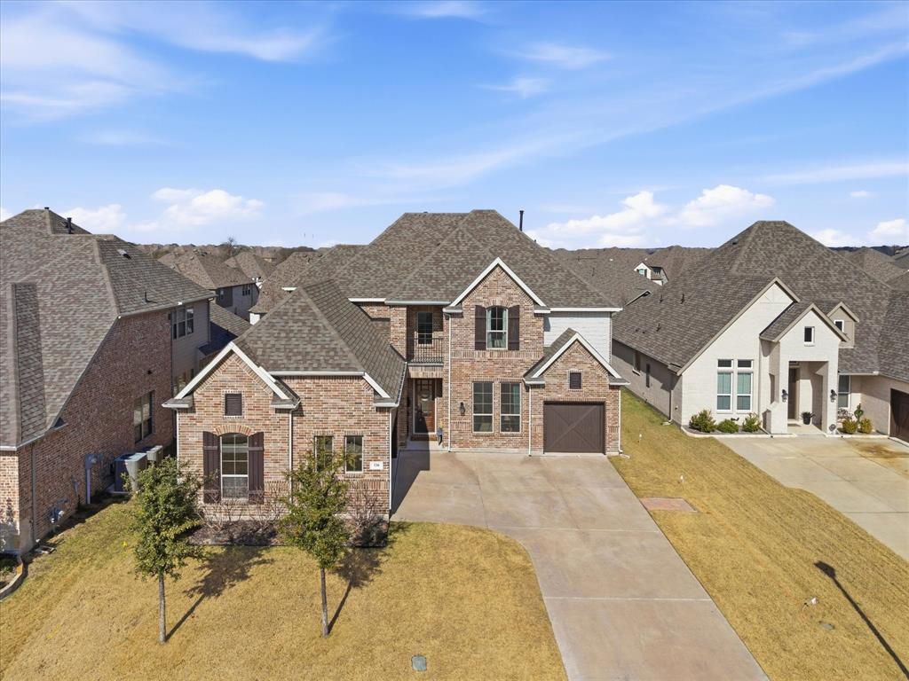 Beautifully designed home in sought-after Rockwall featuring an open, light-filled floor plan with high ceilings and elegant architectural details throughout. The chef’s kitchen is equipped with a built-in refrigerator, expansive island, and abundant cabinetry, flowing seamlessly into spacious living areas ideal for everyday living and entertaining. The primary suite offers a private retreat, while additional bedrooms and flexible spaces provide room to grow. Enjoy a covered patio and generous backyard that backs up to a walking trail in a prime location near shopping, dining, and top-rated schools.
