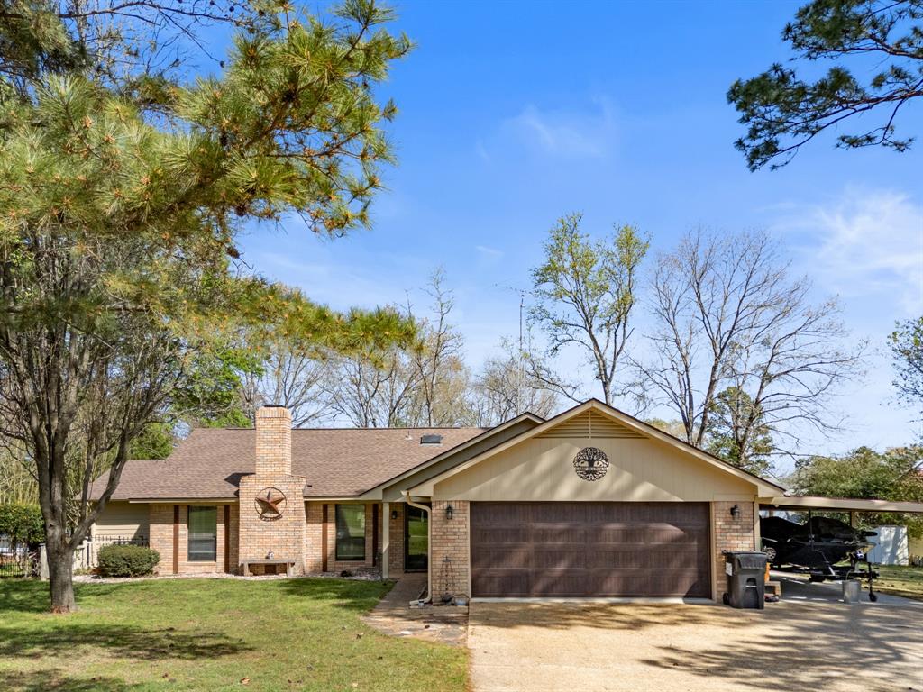 Welcome to your retreat in Holly Lake Ranch, a premier gated community located under 2 hours from the Dallas metroplex and conveniently situated approximately 1 hour from Tyler and Longview. This ideal location offers peaceful East Texas living while keeping shopping, dining, medical facilities, and regional airports within easy reach.
This beautifully maintained 3-bedroom, 2-bathroom home offers 2,127 sf of thoughtfully designed living space, ideal for both everyday comfort and holiday entertainment.
Inside, you’ll find two spacious living areas, providing flexibility for a formal sitting room, media space, office, or game room. A wood-burning fireplace with a blower motor provides a warm focal point, creating an inviting atmosphere for gatherings or quiet evenings at home. The large kitchen is designed with functionality in mind, featuring abundant cabinet storage and generous workspace—perfect for preparing meals while staying connected with guests.
Step outside to an impressive 17 x 29 covered deck that contains a hot tub. Whether hosting holiday celebrations, weekend barbecues, or simply enjoying the peaceful wooded surroundings. Numerous updates in 2025 such as exterior paint, washer & dryer, new sunroom, garage door and repainted covered deck.  Also recently updates are the range, dishwasher and water heater.  The 19 x 25 garage is big enough for a work area or golf cart storage.  In addition, the huge 12 x 38 carport can be utilized to store a boat. 
Beyond the home itself, Holly Lake Ranch offers an exceptional array of amenities, including an 18-hole golf course, tennis and pickleball courts, scenic hiking trails, a dog park, and excellent fishing opportunities. The community also features numerous social organizations and clubs, providing countless opportunities to build lasting friendships.
Meticulously cared for and move-in ready, this property combines comfort, space, and resort-style living in one of East Texas’ most sought-after communities.
