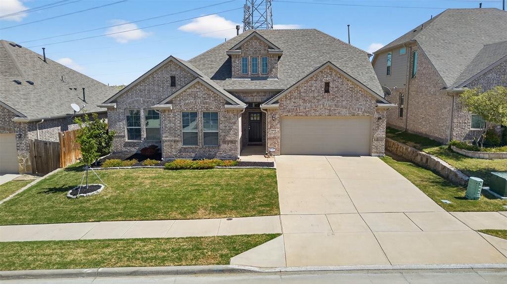 Welcome to this beautifully designed home located in the highly sought after Northwest ISD. With a spacious and functional layout, this home offers the perfect blend of style, comfort, and everyday livability. Step inside to soaring ceilings, abundant natural light, and an open concept living space that feels bright, airy, and inviting. Rich wood flooring flows through the main living areas, while the expansive family room opens seamlessly to a stunning kitchen featuring quartz countertops, gray shaker cabinetry, stainless steel appliances, a gas range, oversized island with seating, and designer pendant lighting. The private primary suite is a true retreat with generous space, large windows, and a spa inspired ensuite bath complete with dual vanities with a glass enclosed shower and a walk in closet. Secondary bedrooms are well sized and thoughtfully positioned, while the upstairs game room offers incredible flexibility for a media room, playroom, or second living area.

Out back, enjoy a covered patio built for relaxing and entertaining, complete with an outdoor kitchen and plenty of space to gather with family and friends. From the charming curb appeal to the modern finishes throughout, this home checks all the boxes. Located in desirable Northwest ISD with convenient access to shopping, dining, and major thoroughfares, this is one you do not want to miss.