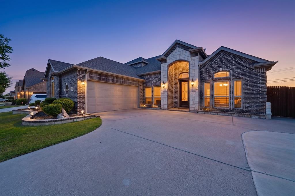 Beautifully maintained 4-bedroom, 3.5-bath home in highly sought-after Mansfield ISD! Built in 2017, this spacious home features an open-concept layout with soaring ceilings, abundant natural light, wood flooring, and a stunning stone fireplace. The chef’s kitchen offers double ovens, a 5-burner gas cooktop, large island, and ample cabinet space — perfect for entertaining. Private primary suite includes dual vanities, soaking tub, separate shower, and walk-in closet. Buyer's to take over the Solar or it can be paid off at closing. 2-EV charges included in the garage. Enjoy a covered & extended patio, fenced backyard, and convenient access to shopping, dining, parks, and major highways. Two bathrooms were remodeled by Expo Home with warranty. Move-in ready with modern style and functional living spaces throughout!