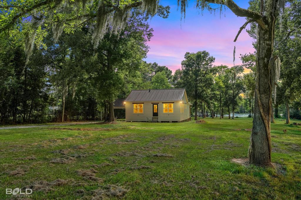 Escape to Lake Bistineau with this beautifully remodeled waterfront retreat situated on 4.8 acres and offering approximately 216 feet of water frontage. Whether you're searching for a primary residence, weekend getaway, or second home, this move-in-ready property delivers the perfect blend of comfort, privacy, and lakefront living.

This 2-bedroom, 2-bathroom home features 1,247 square feet of thoughtfully updated living space with two living areas and extensive renovations completed in 2023 and 2024, including the roof, plumbing, electrical, and bathrooms. The inviting interior is designed for easy living while taking full advantage of the surrounding views.

The true highlight of the property is the expansive covered back porch, where you'll enjoy peaceful water views and breathtaking sunsets over the lake. Whether you're sipping your morning coffee, entertaining family and friends, or simply relaxing after a long day, this outdoor space is sure to become your favorite spot.

With 216 feet of shoreline, 4.8 acres of land, and major system updates already completed, this property offers the rare opportunity to enjoy waterfront living without the worry of costly renovations. Spend your days fishing, boating, kayaking, or simply taking in the natural beauty that makes Lake Bistineau such a treasured destination.

If you've been dreaming of a private waterfront escape where the work has already been done, this Lake Bistineau gem is ready to be enjoyed from day one.