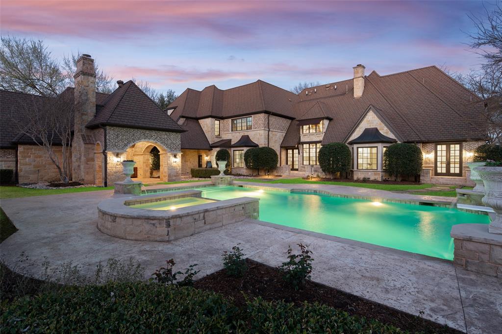 Gated custom estate offering privacy and tranquil living in a serene setting in Preston Hollow. Stately exterior with front circular drive nestled on a 1+ acre lot in an atmospheric tree lined neighborhood. Well thought out floor plan with generous room sizes, open kitchen-living concept, downstairs primary suite, study, and separate guest suite. Upstairs hosts three additional en-suite bedrooms. Equipped media room, plus game room overlooking the spacious backyard with pool, large grassy area, outdoor living with fireplace and grilling station. Quality finishes and design are evident throughout the interior and exterior of this exceptional property. See link for virtual tour.