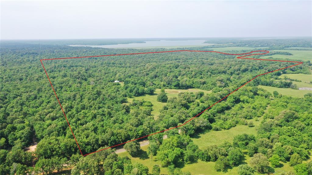 Stamps Hills Ranch is the perfect hunting and recreational combination property located in northern Lamar County, ideally situated between Pat Mayse Lake and the Red River.  This ranch has superb habitat coverage and deep ponds for excellent fishing. Trophy class whitetails have all they need with ample forage, plentiful bedding cover, and limited pressure on this 400-plus acre property.  Sit on the long porch of the completely modern log cabin and look out over this exceptional property that is ideal for wildlife. Bordering Pat Mayse State Wildlife Management Area known to produce big whitetails, slab crappie and plentiful ducks, this property has it all. Slide a canoe into Sanders Creek on the west boundary and paddle to the Red River, just a half mile downstream.  Rarely does such an exceptional recreational property like Stamps Hills come on the market, and especially within two hours of downtown Dallas.