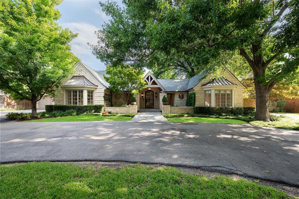 Situated on an elevated .931-acre lot in the heart of old Preston Hollow, this Classic French Country estate offers an unparalleled living experience. The property is secluded, accessed by a private gated driveway, and surrounded by meticulously manicured landscaping, creating a sense of tranquility and privacy. Offering 6 bedrooms, 6.1 baths, and 3 living areas, this home provides ample space for both relaxation and entertainment. Each living area boasts stunning views of the gardens and pool, elevating the home's overall ambiance. The kitchen is a chef's dream, equipped with a Viking gas cooktop and a spacious breakfast bar that opens to the living room, allowing for seamless entertaining and gatherings with family and friends. From its secluded location and pristine landscaping to its luxurious amenities and elegant design, this French Country estate offers a truly unmatched living experience in one of the most desirable neighborhoods in Dallas.