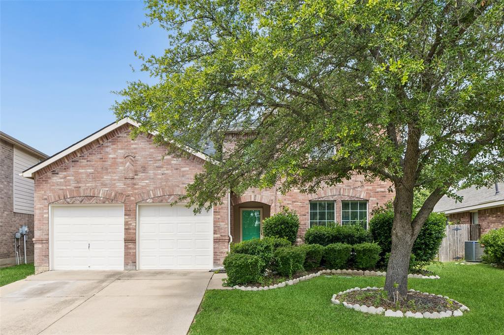 Beautifully maintained 5-bedroom, 3.5-bath Northwest Fort Worth home near Saginaw and Eagle Mountain Lake offering a versatile layout, abundant natural light, and inviting living spaces throughout. Large windows brighten the welcoming living room, where a stately fireplace flows seamlessly into the spacious eat-in kitchen featuring a large island, built-in appliances, ample storage, and generous prep space. The main-level primary suite has been beautifully updated with lighted mirrors, abundant storage, dual sinks, and a spacious walk-in closet. Upstairs, generously sized secondary bedrooms provide flexibility for a variety of needs, while a large second living area is perfect for a game room, media room, or additional living space. A dedicated home office offers an ideal setup for remote work. Recent improvements include new downstairs flooring, new fencing, a sprinkler system, an electric vehicle charging plug, and a custom-built storage shed. Enjoy the private backyard and covered patio, highlighted by a rare and beautiful Cachalpa tree known for its stunning orchid-like blooms throughout much of the year. Conveniently located near parks, shopping, dining, and everyday conveniences, this home is also just moments from a scenic community lake with a beautiful walking trail and offers quick access to Eagle Mountain Lake for additional outdoor recreation. Combining comfort, functionality, thoughtful updates, and an exceptional location, this move-in-ready home is ready for its next chapter. 3D tour available online!