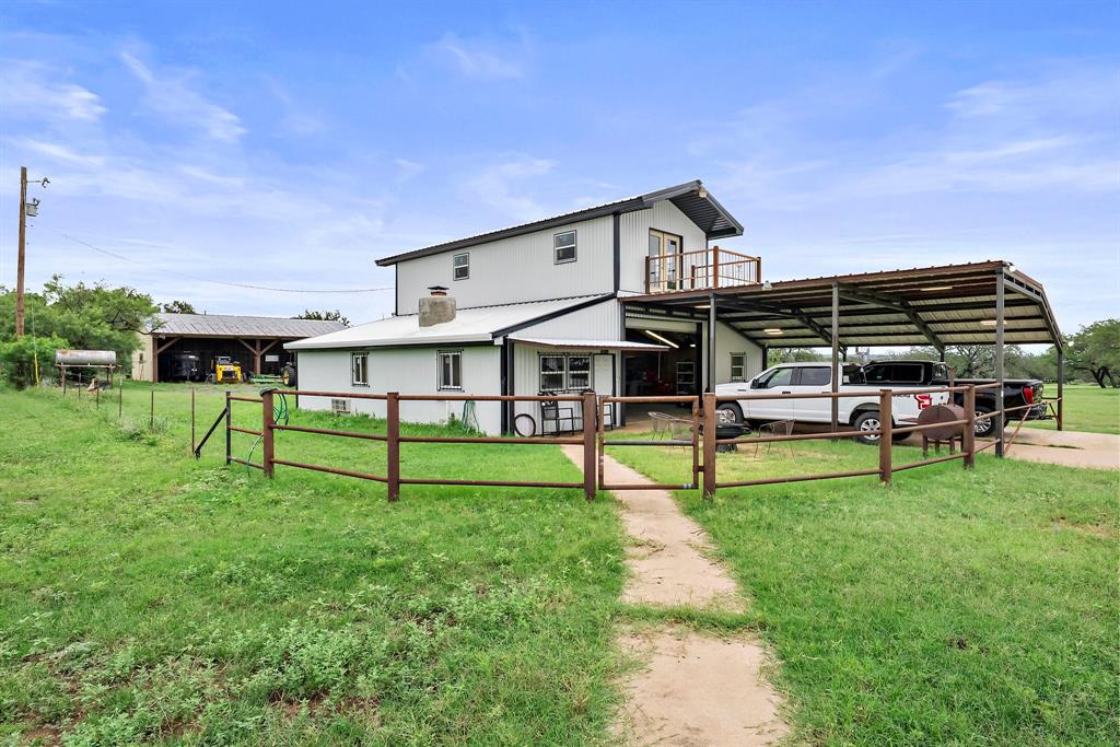 Nestled on a hilltop in the heart of the Texas Hill Country, this property provides a unique opportunity to have your own private ranchette where you can enjoy country living while still close to town. Located just 5 minutes from Marble Falls, 10 minutes from Burnet, and an hour from Austin and Fredericksburg, this gem allows easy access to nearby conveniences. The breathtaking views of the surrounding hills and lake LBJ is worth the price of admission alone. Spanning over 21 acres, this property caters to those looking for a scenic and private lifestyle interested in recreation and agriculture. Whether your goal is to build your forever home looking out over the bluff, start a homestead, or use the property as-is, the options are endless. Upon entering the property you will pass through your very own custom automatic gate and be greeted by the stock tank on the right hand side. Scattered oak trees litter the property while mixed with improved grass. The long asphalt driveway will bring you to the efficient barndominium, fed by well water, with two roll-up garage doors and a pipe fenced-in yard. The 2 car attached carport allows for plenty of parking, leaving your shop open for whatever project you may have! Inside the living quarters you will find a cozy kitchen and custom plaster wood-burning fireplace sure to keep you warm during the coldest nights. Upstairs in the loft is a rustic blank slate waiting for your touch accompanied by a balcony with a stunning view. Behind the barn, you will find a 55'x20' equipment shed and a set of cattle working pens. You don't have to look far for entertainment, within 30 minutes drive is Lake Buchanan, Inks Lake State Park, Station Mountain State Park, Lake LBJ, Apple Rock Golf Course, Delaware Springs Golf Course, Hidden Falls Adventure Park and more! Don't miss out on the opportunity to make this extraordinary property your own and schedule a showing today!