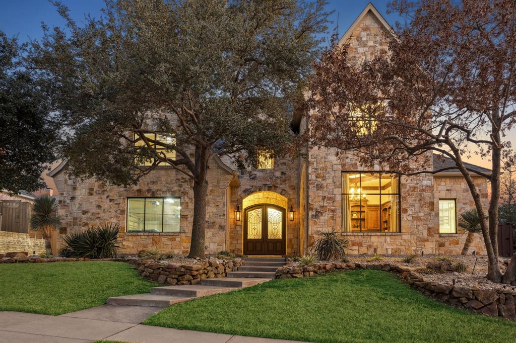 Welcome to this custom luxurious 5,731 square foot residence built by Lonnie Gray.  Grand scale with everyday livability, offering four bedrooms, four and a half baths, and an ovszd three-car garage, the thoughtfully designed floor plan accommodates both elegant entertaining and comfortable daily living.  Nestled under a canopy of mature trees and within the highly sought-after Shoal Creek community, residents enjoy scenic jogging trails, tranquil neighborhood ponds, and a prime location just minutes from DFW Airport, and the Grandscape Legacy West areas, providing premier shopping, dining, and entertainment.  From the moment you enter, the home's quality and craftsmanship are immediately apparent. Soaring ceilings, intricate crown molding, rich hardwood floors, and expansive walls of windows create a bright and inviting atmosphere filled with natural light. Private study with custom built-ins offers an ideal work-from-home environment.  Formal living room showcases a stunning chandelier equipped with an electronic lift for effortless maintenance.  Designed with both functionality and sophistication in mind, the expansive floor plan features dual staircases, formal living and dining rooms, a private den, dedicated media and game rooms, multiple gathering spaces throughout.  The chef's kitchen is equally impressive, featuring a Sub-Zero refrigerator, double ovens, a six-burner gas cooktop, dual sinks, abundant prep space, and extensive cabinetry. A wet bar and three fireplaces further enhance the home's welcoming ambiance.  Step outside to a private backyard retreat surrounded by mature trees and lush landscaping. Designed for year-round enjoyment, the outdoor living space includes a sparkling pool and spa with waterfall features, a built-in BBQ, outdoor firepit, and a turf play space.  Completing the home's timeless appeal, gas lanterns frame the front elevation. Rarely does a home offer such craftsmanship, and comfortable luxury living and perfect for entertaining.
