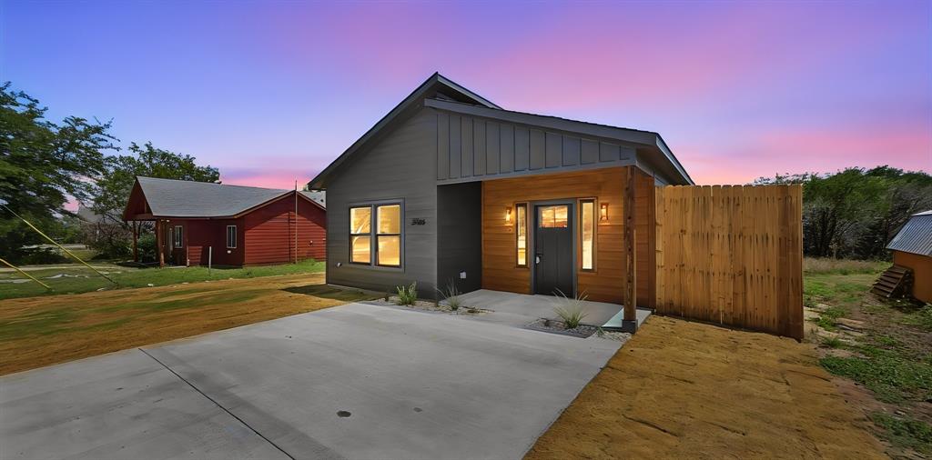 Welcome home to this modern contemporary brand new construction home located in the heart of Granbury! Every attention to detail along with appealing upgrades have been put into this spectacular home! Proudly built with care and craftsmanship by local builder MB Development. The finer details: Elegant white quartz countertops in the kitchen, primary bathroom, and guest bathroom. Beautiful electric fireplace in the living room perfect for those colder winter nights and relaxing ambiance. Upgrade stainless appliances in the kitchen. Cooktop stove, dishwasher, and built in microwave oven. Modern slim shaker cabinets throughout with soft close hinges offer convenience and a sleek custom look. Luxury ultra wide vinyl plank flooring throughout shows a luxury and clean look. Living room and all 3 bedrooms come with ceiling fans and walk in closets. Primary bathroom has stunning white quarts countertops, double sinks, oversized walk in shower, and a super size walk in primary bedroom closet! Oversized utility room with full size washer and dryer space and a convenient utility closet inside the utility room. Beautiful black Hardi siding on the exterior, covered front porch, 8 foot wood privacy fence on the sides with an open view fence out the back of the property. The views out the back of the property are amazing! Beautifully wooded greenbelt sloping down to a seasonal creek. Full sod front and back yard. The basics: 3 bedroom, 2 bath, 1416 square feet, built and completed in 2026. Concrete driveway with an ample room for parking. This home is conveniently located near the very end of a secluded and private cul de sac. Community offers Lake Granbury access with a boat ramp, community pool, community park and playground, and clubhouse. Home is located outside the city limits with no city taxes! This new construction home is priced to sell and offers all the perks you are looking for!