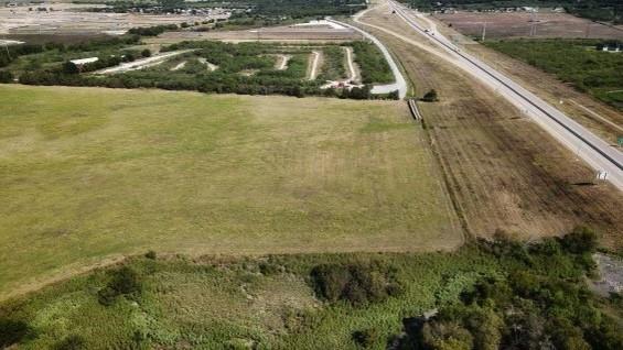 Introducing a prime 32 acre parcel with 894 feet of frontage along the prestigious Chisholm Trail Parkway, conveniently located on the Cleburne and Joshua border. The front 4.5 acres are nestled within the Cleburne city limits, providing unique development opportunities.This exceptionally level property is ideal for both commercial development and industrial use. Don't miss this rare chance to acquire a stunning piece of land with immense potential. Seize the opportunity today!